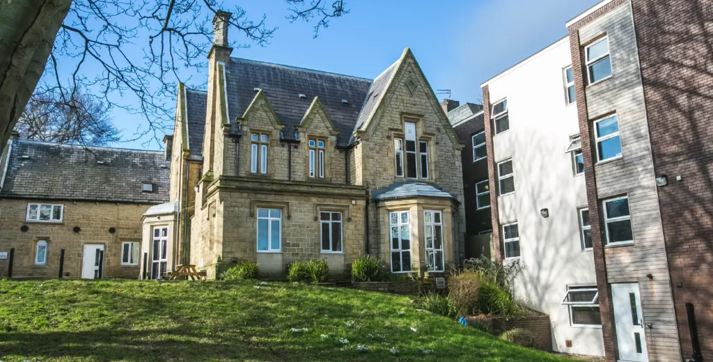 Exterior view of the old building and gardens at St Anns Lodge - Student Accommodation