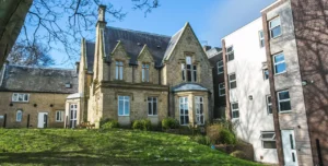Exterior view of the old building and gardens at St Anns Lodge - Student Accommodation