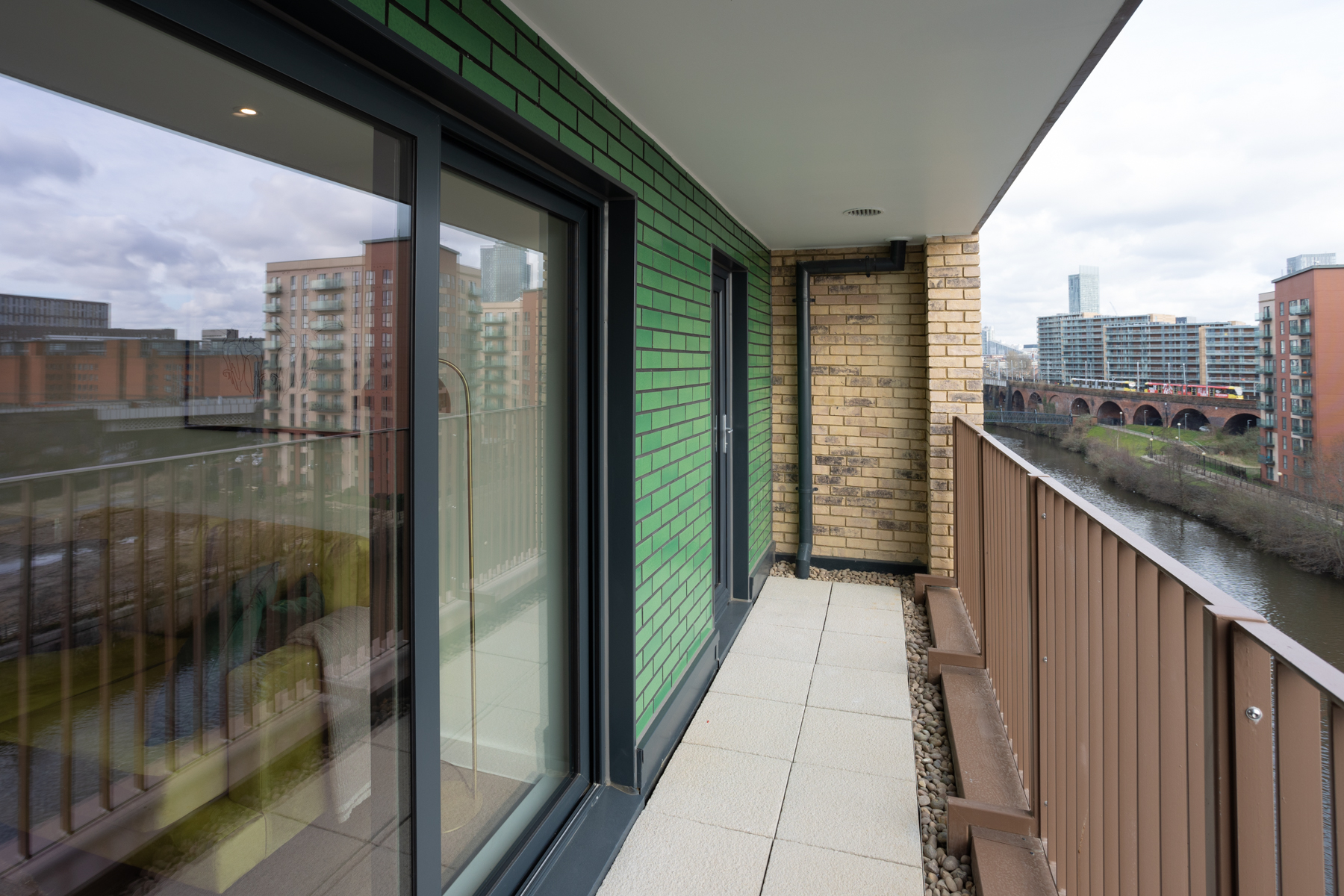 Exterior view of balcony looking out over the River Irwell and Manchester.