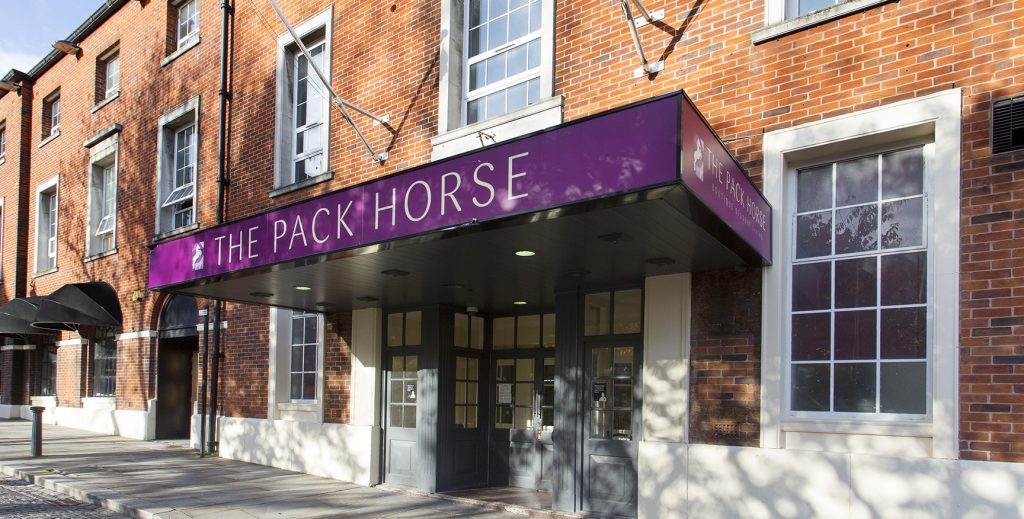 Entrance to the Pack Horse showing a purple cover over the door with the Pack Horse sign running across the front.
