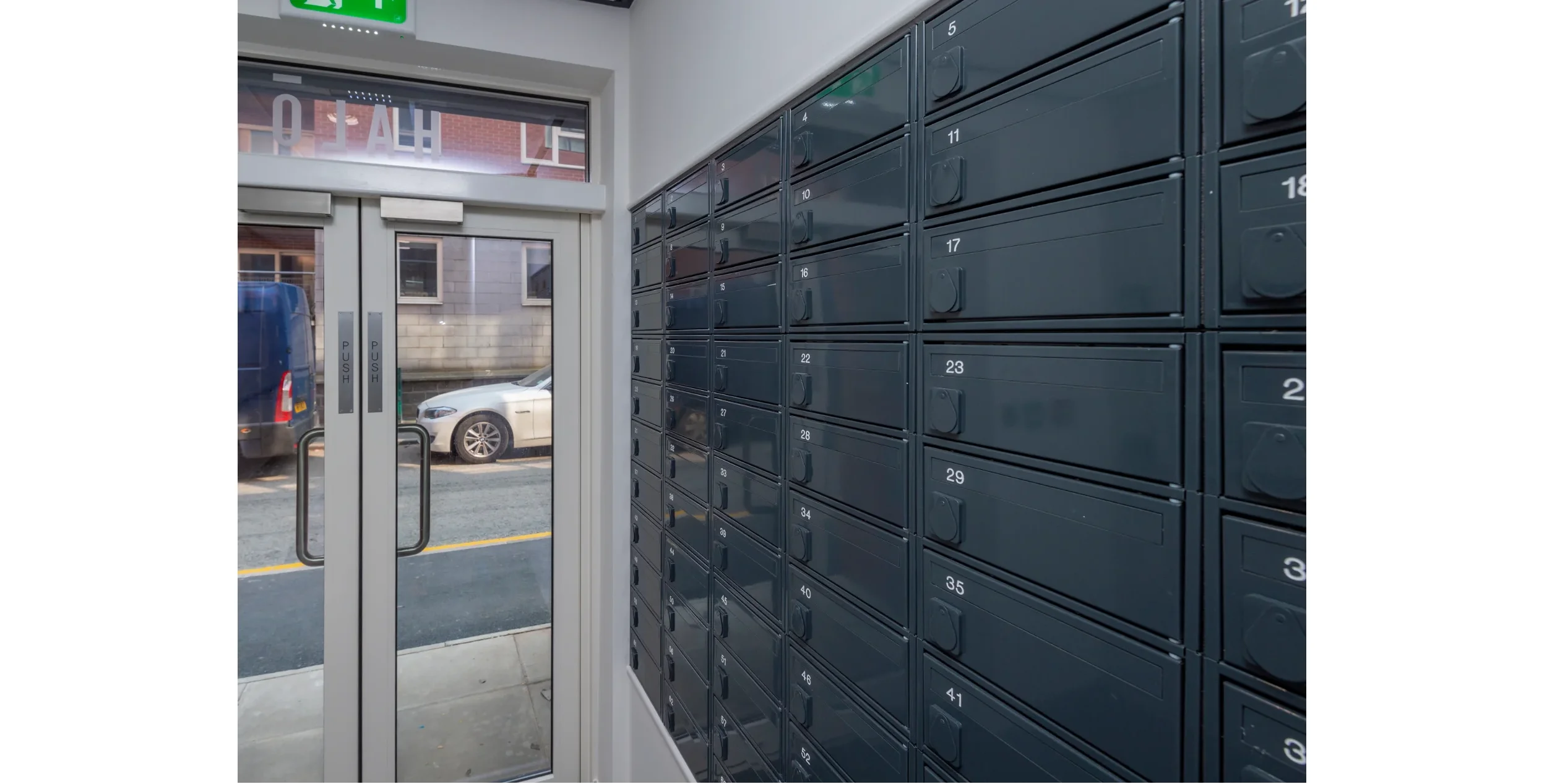 View of the secure parcel and letter boxes inside of main door to Halo Apartments