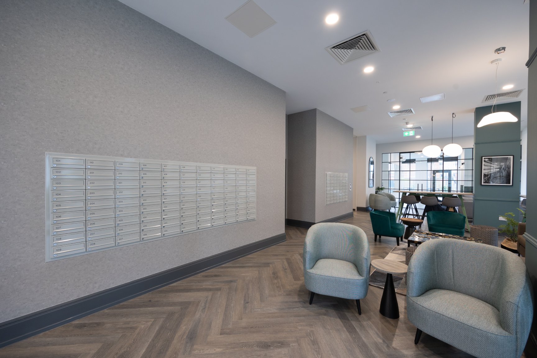 Communal area with a wall of letter boxes for tenants.