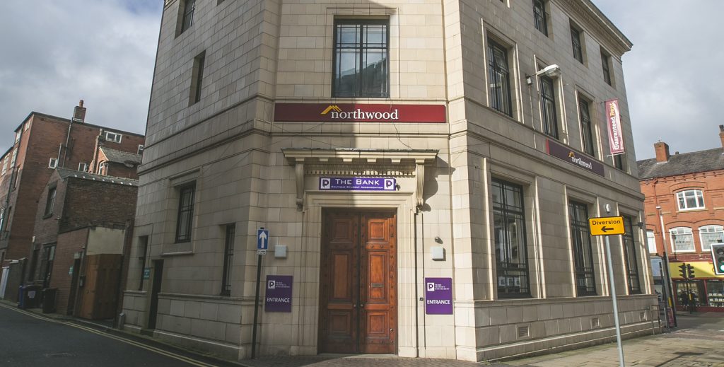 Front door of the bank on the corner of the street