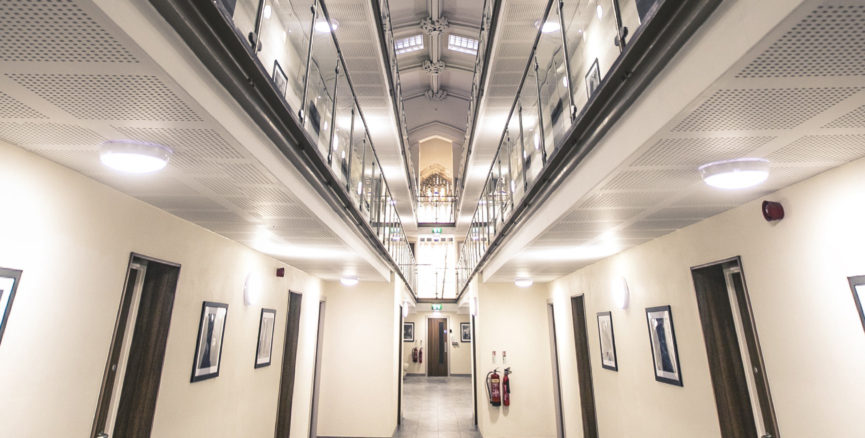 Interior communal walkways with glass balustrades