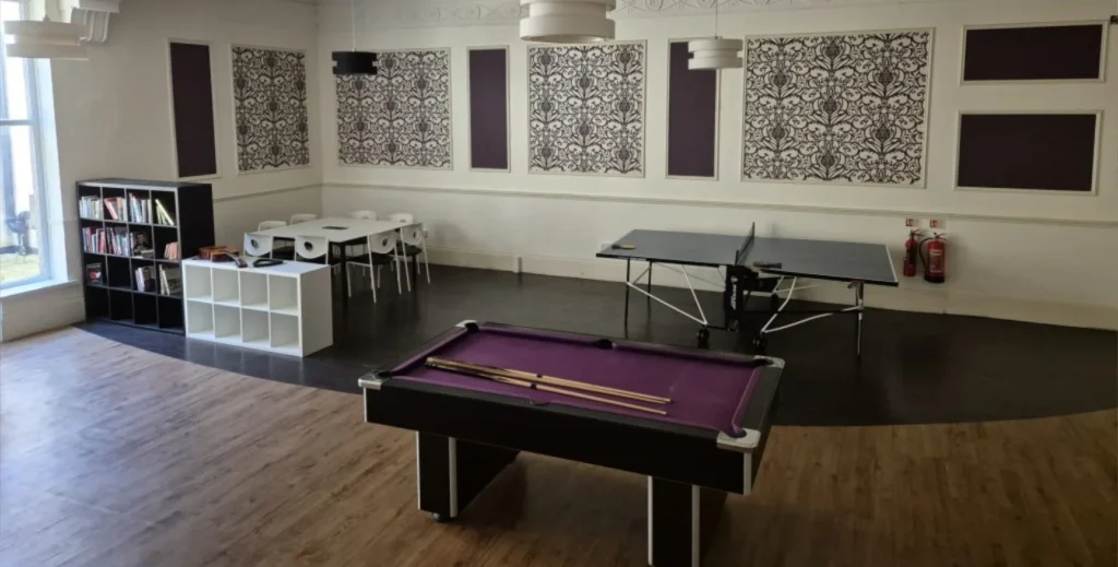 Games area at the Pack Horse with a pool table, table tennis table and table and chairs.