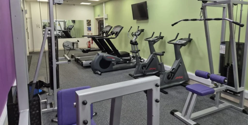 The Pack Horse Gym with an array of weights benches and cycle machines.