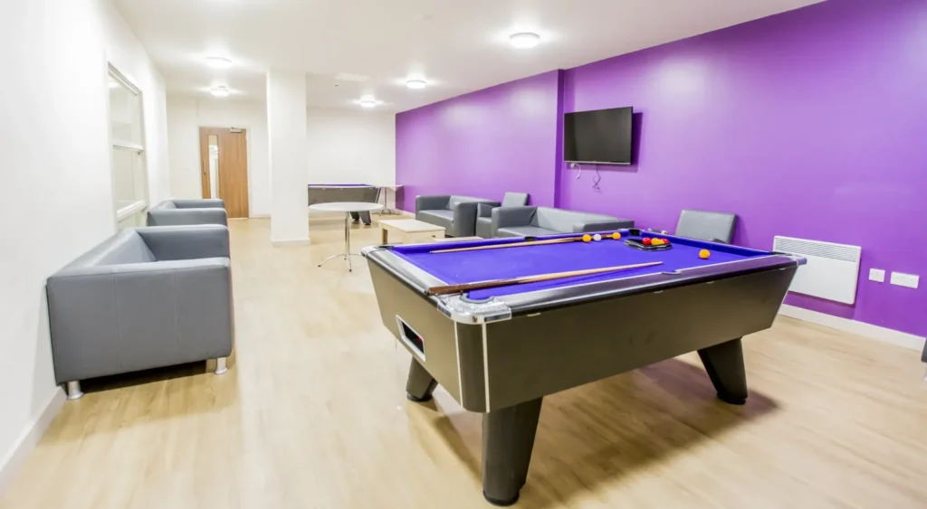 Student communal area with TV and pool table.